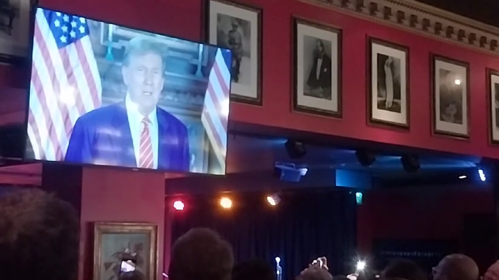 A video message from Donald Trump being played at Nigel Farage's birthday party