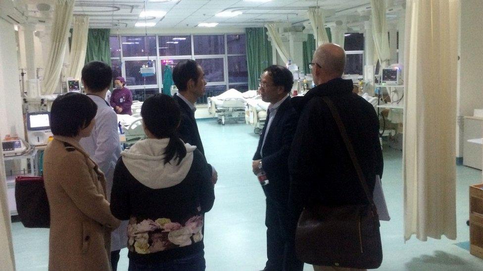 Zhang and Holmes with colleagues at Wuhan Central Hospital