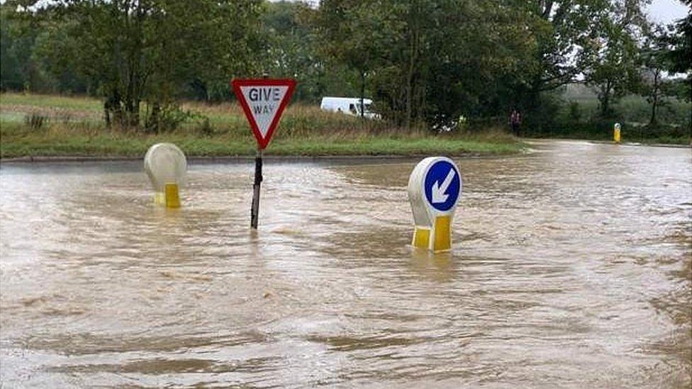 Flooded road in Stradishall