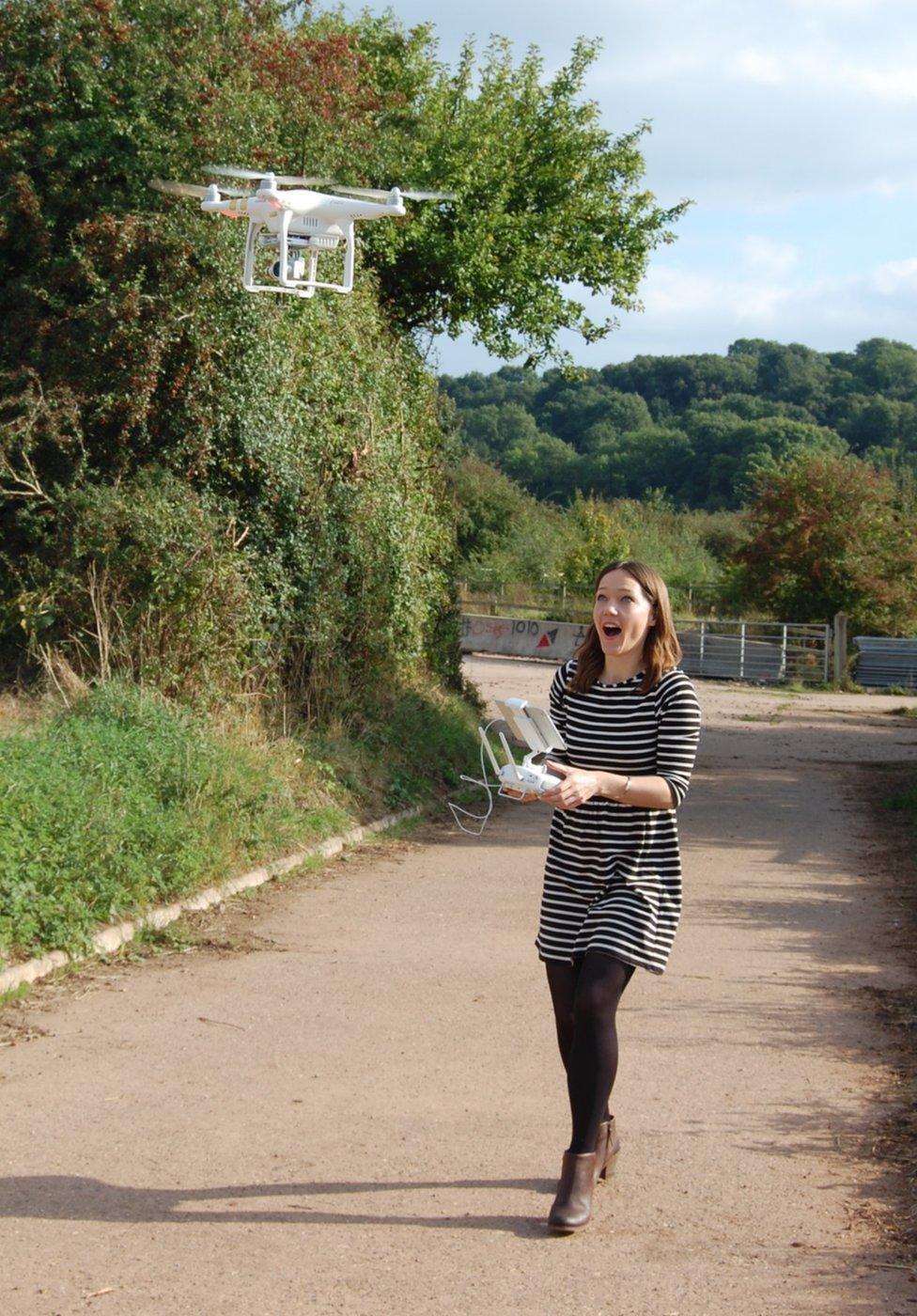 Caroline looking worried while flying drone