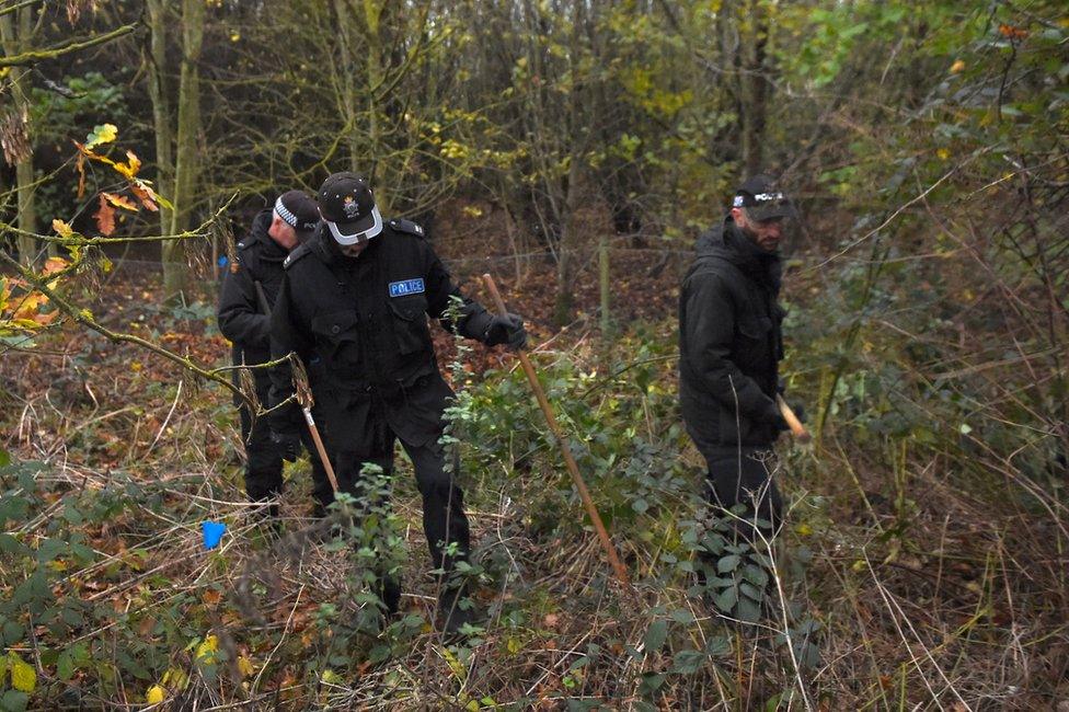 Police search an area of Sence Valley Forest Park on Tuesday