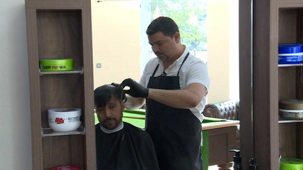 Ghani cutting hair