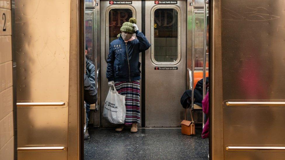 A traveler wears a medical mask at Grand Central station on March 5, 2020 in New York City