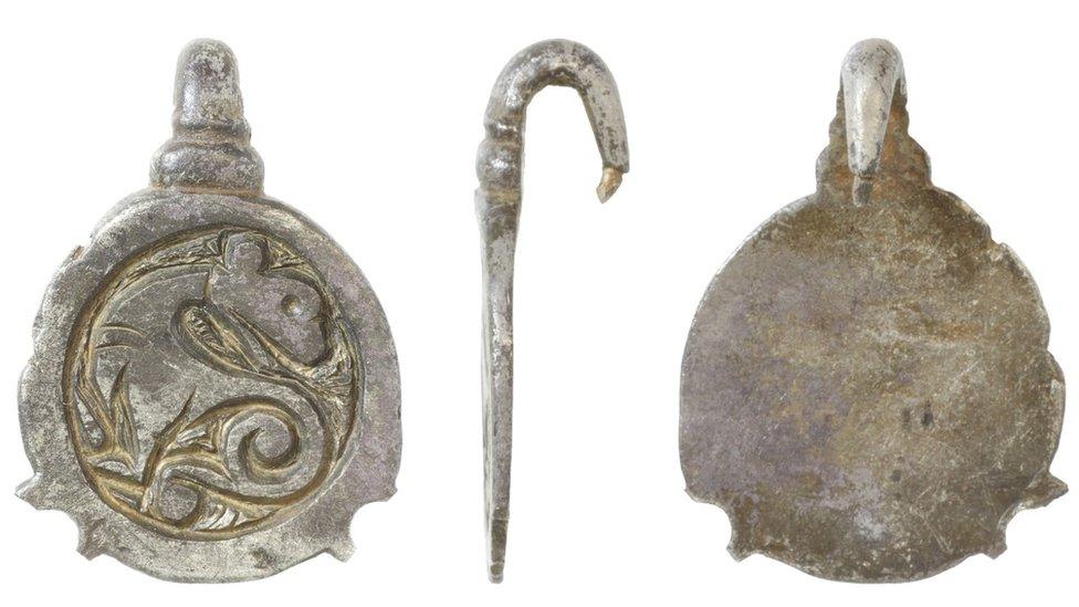 Early-medieval silver hooked tag