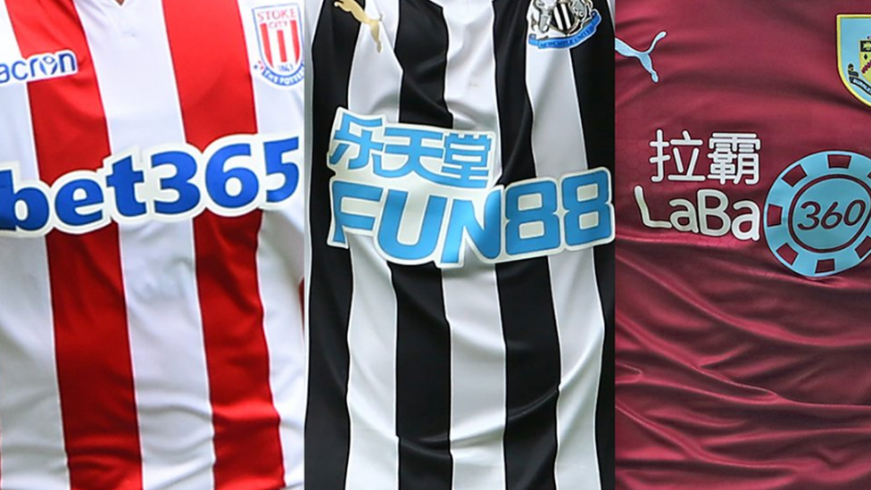 Composite-image-of-football-shirts-showing-gambling-logos.