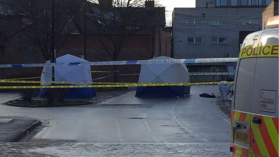 Police tape and tents erected at the scene