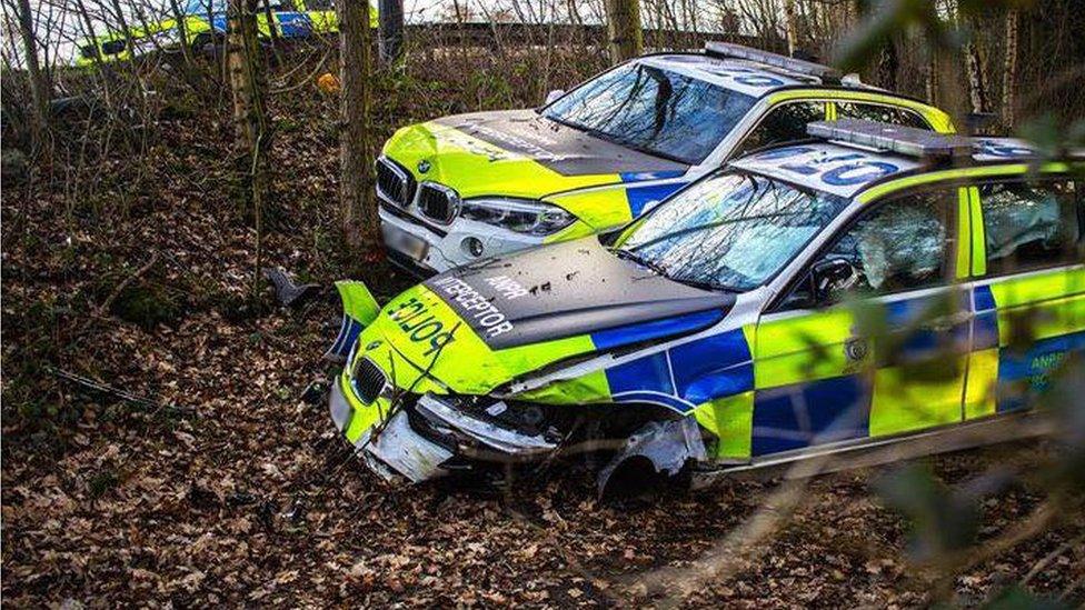 Police cars damaged in crash