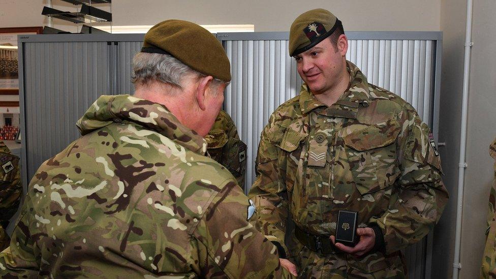 Prince Charles (facing away) and Sgt Gavin Hillier