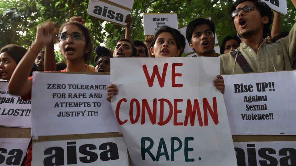 Indian students shout slogans during a protest against the rapes of two minor girls outside the police headquarters in New Delhi on October 18, 2015