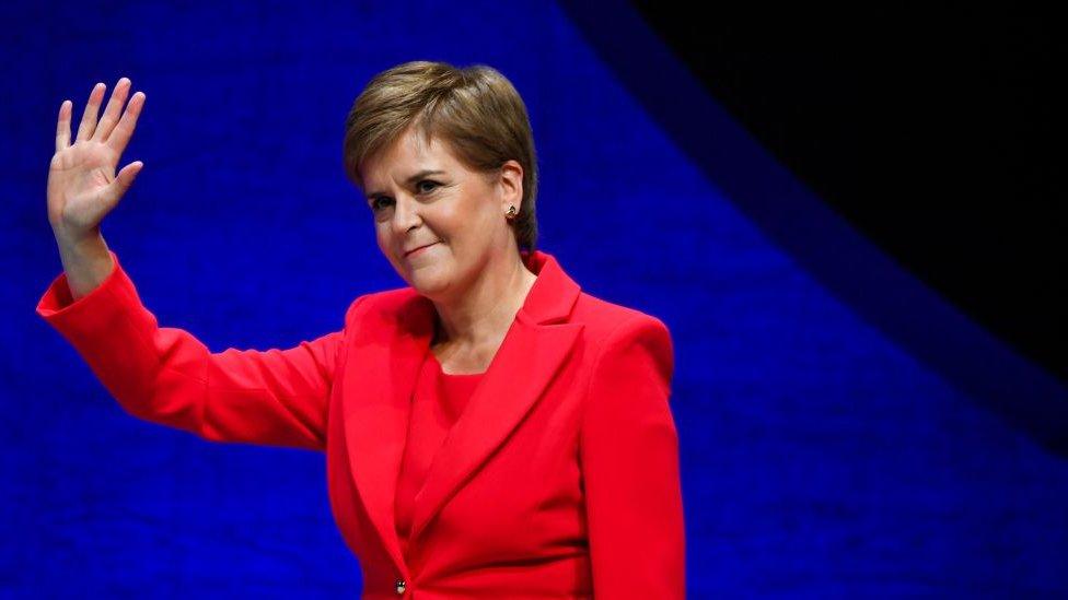 Scotland's First Minister and leader of the Scottish National Party (SNP), Nicola Sturgeon, waves as she arrives on stage to deliver her speech to delegates at the annual SNP Conference in Aberdeen, Scotland, on October 10, 2022. (Photo by ANDY BUCHANAN / AFP) (Photo by ANDY BUCHANAN/AFP via Getty Images)