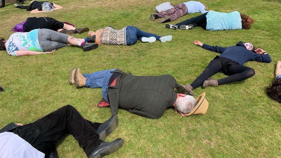 Protesters stage a "die-in" at Tynwald day