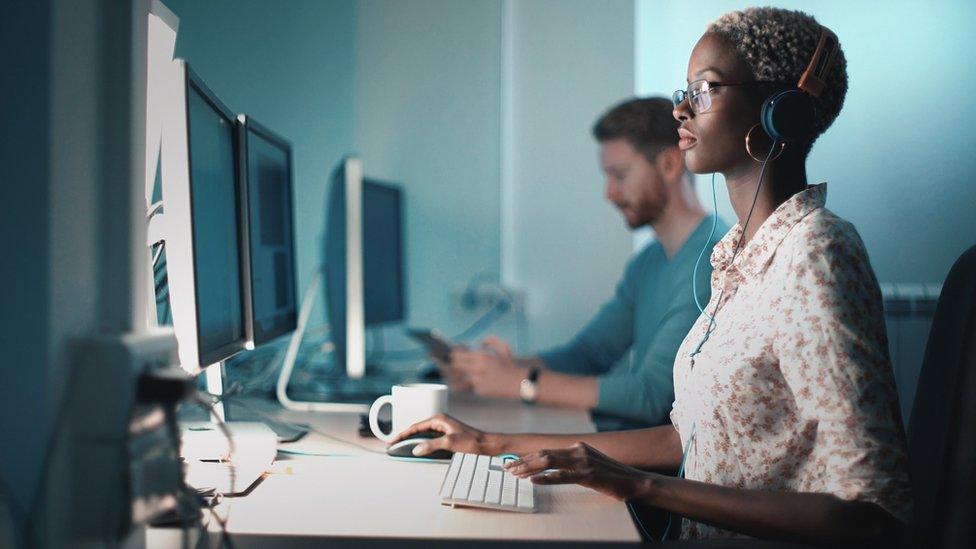 Woman doing her design project on a computer