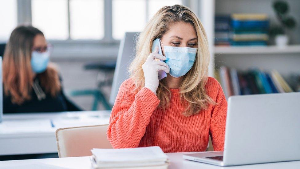 Office workers in masks