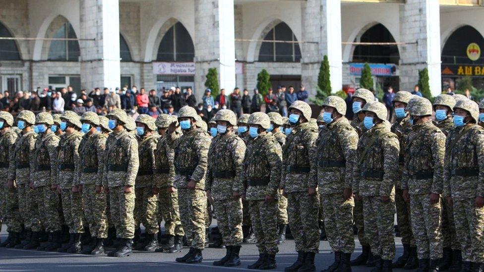 Members of Kyrgyz armed forces stand in formation in Ala-Too Square