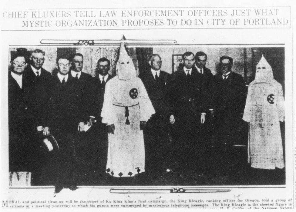 Old newspaper photo of KKK chapter leaders with prominent police and local government officials in 1921