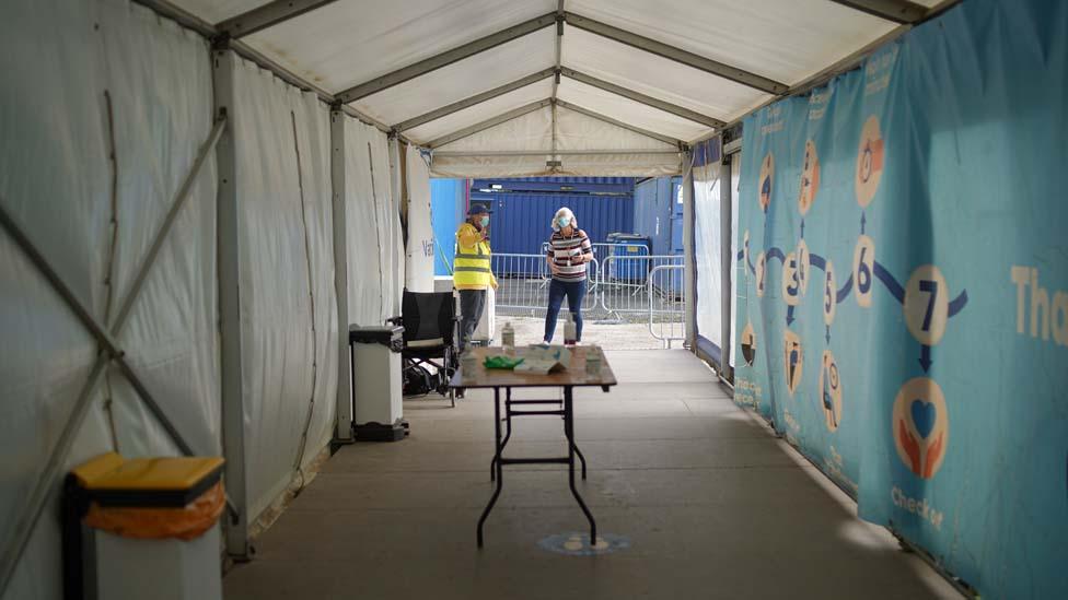 People at a Falmouth vaccine centre