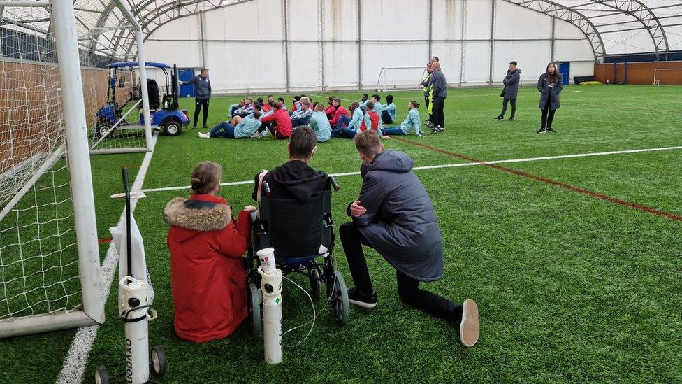 Ben, and Ipswich Town staff inside their training dome at the club's training ground.