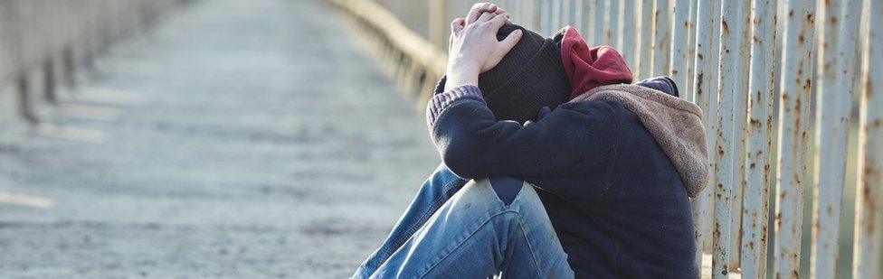 Boy on a railway bridge