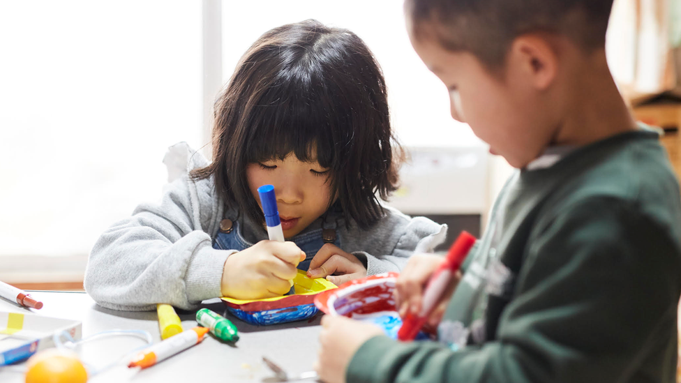 Two children drawing