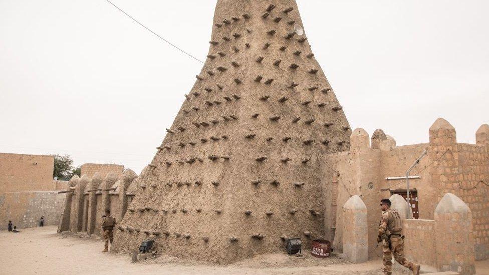 French soldiers patrol Timbuktu for the last time a few hours before the handover ceremony of the Barkhane military base to the Malian army in Timbuktu, on December 14, 2021