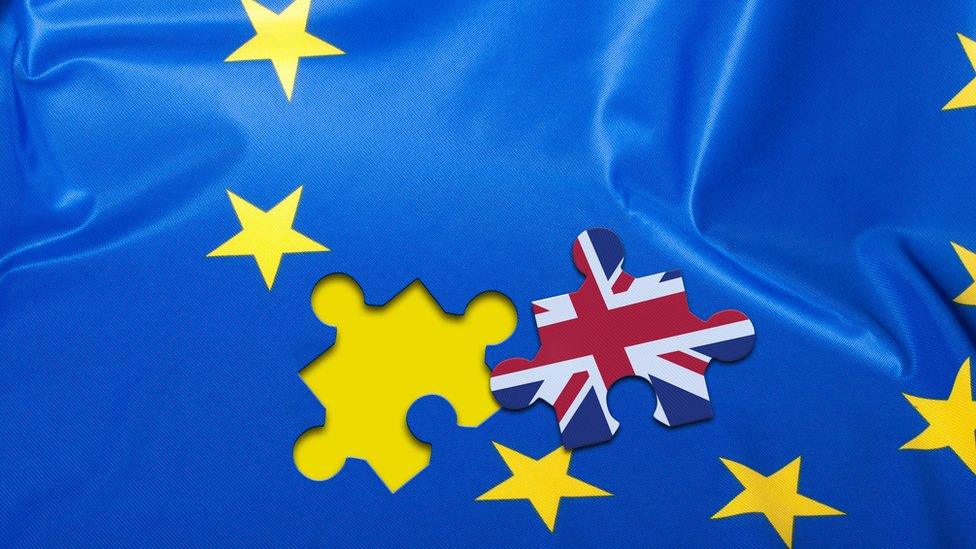 Union flag jigsaw piece on an EU flag