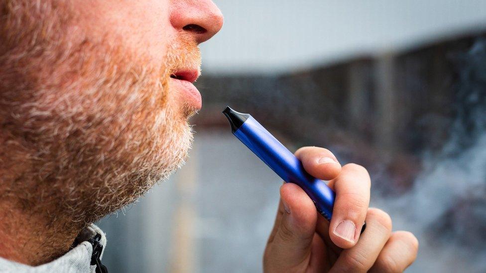 Man smoking disposable vape