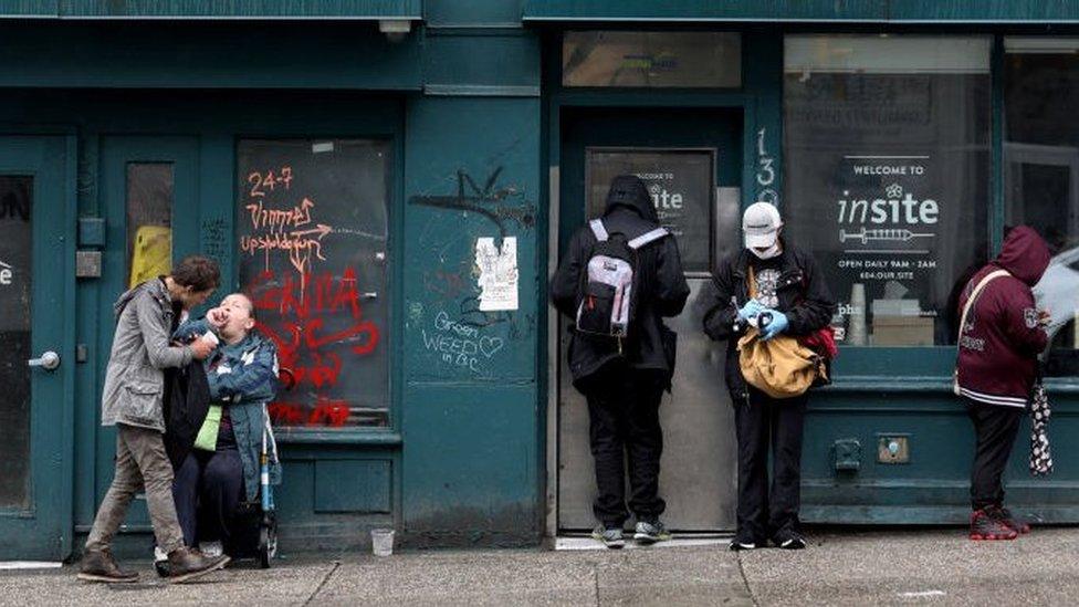 Clients wait outside of Insite, a supervised consumption site located in the Downtown Eastside (DTES) neighborhood of Vancouver