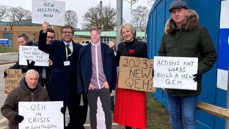 Cardboard cut-out of Lord Markham with protesters