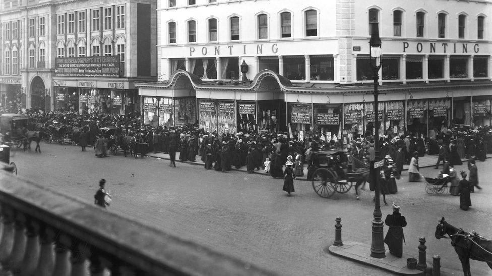 People queuing for a department store opening in 1907.