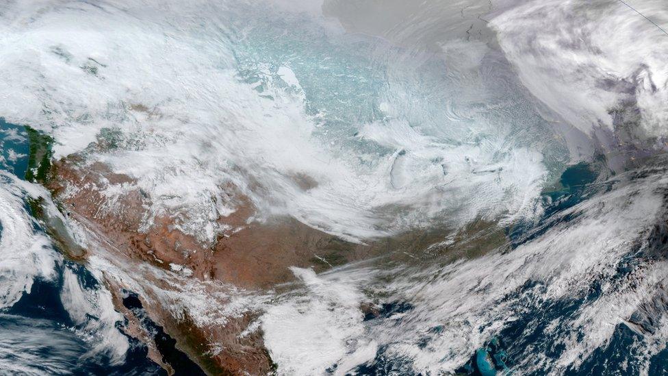 A satellite image of the continental United States shows the extreme cold weather phenomenon called the polar vortex over the U.S. Midwest and Great Lakes regions