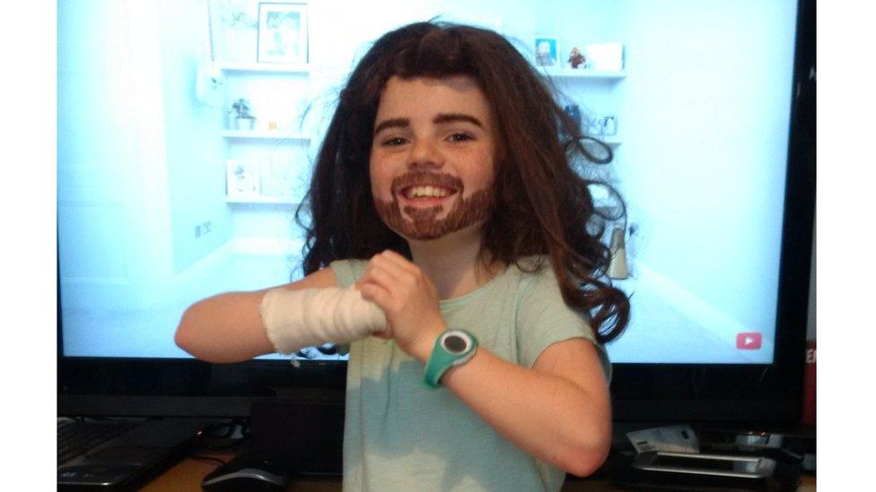 girl-with-drawn-on-beard-and-eyebrows-dressing-up-as-joe-wicks