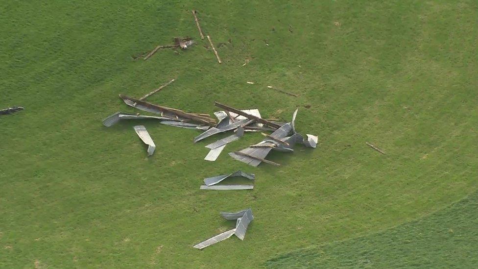 Roof tiles from a barn roof lie destroyed in the middle of a field in County Londonderry