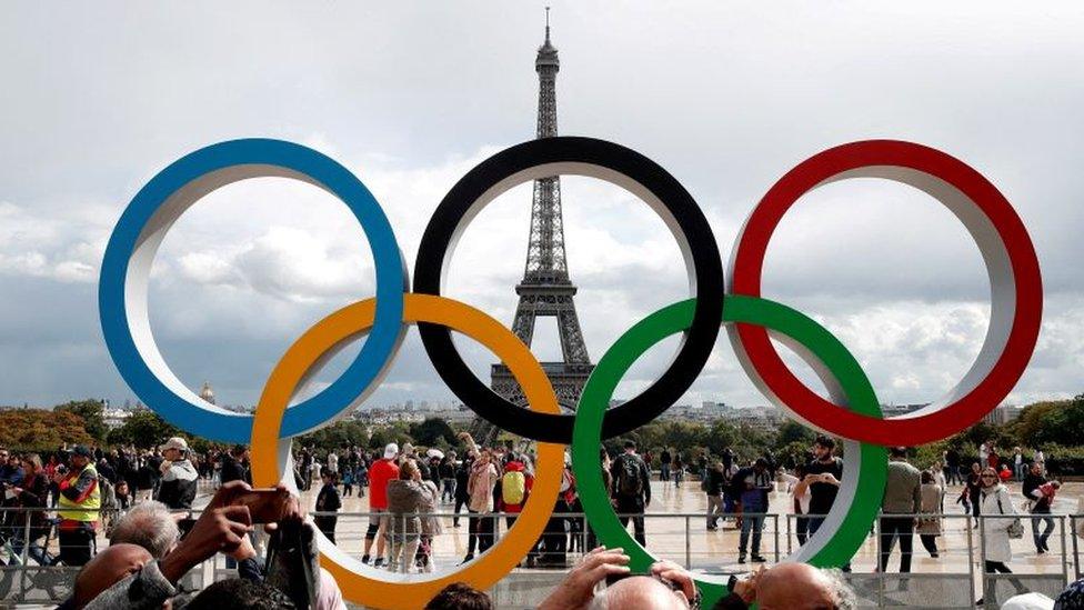 Olympic rings in front of the Eiffel Tower