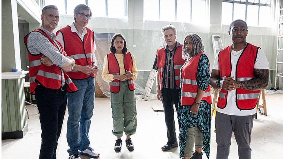 Picture shows: John (DARREN BOYD), Greg (STEPHEN MERCHANT), Rani (RHIANNE BARRETO), Frank (CHRISTOPHER WALKEN), Myrna (CLARE PERKINS), Christian (GAMBA COLE)