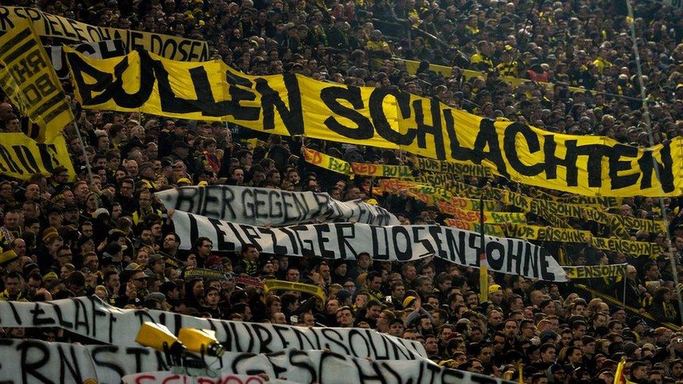 Supporters of Dortmund displaying banners prior to the German First division Bundesliga football match between Borussia Dortmund and RB Leipzig on 4 February