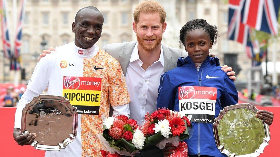 Eliud Kipchoge and Brigid Kosgei with Prince Harry