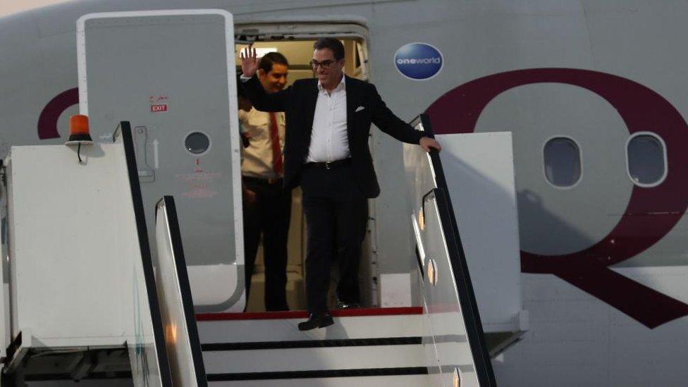 Namazi seen exiting the plane from Iran