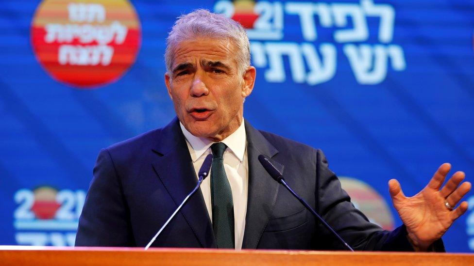 Yesh Atid party leader Yair Lapid delivers a speech in Tel Aviv following the exit polls in Israel's general election