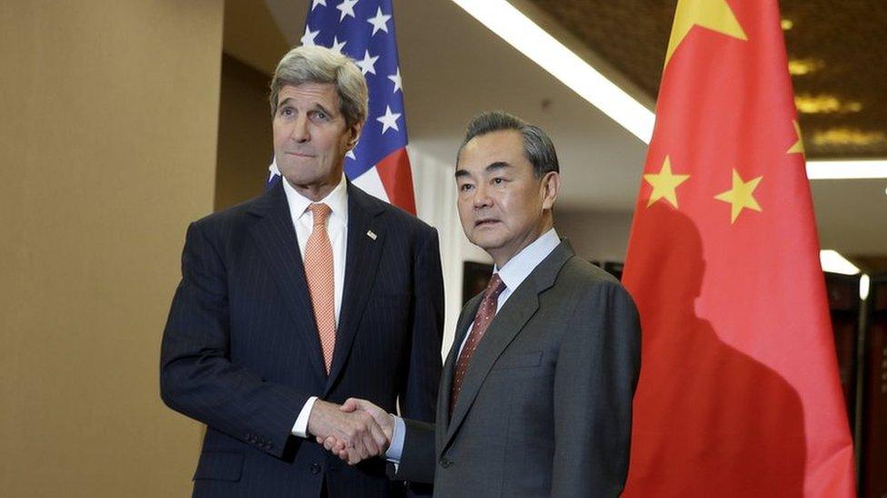 US Secretary of State John Kerry (L) and Chinese Foreign Minister Wang Yi shake hands before their bilateral meeting at the Ministry of Foreign Affairs in Beijing 27 January 2016