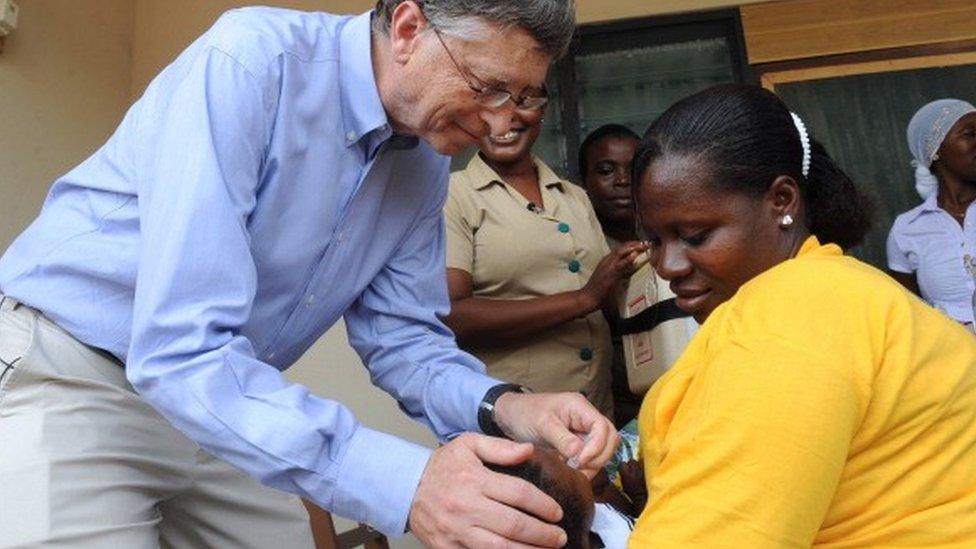 Microsoft's Bill Gates, one of the world's richest men and highest profile aid donors, gives to a child a rotavirus vaccine against diarrhoea at the Ahentia Health Centre, in Awutu Senya district, in the Central Region of Ghana, on March 26, 2013.