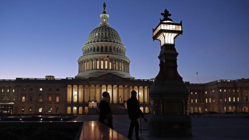 The sun sets behind the U.S. Capitol Dome during the first evening of President Donald Trump's impeachment trial January 21, 2020 in Washington, DC.