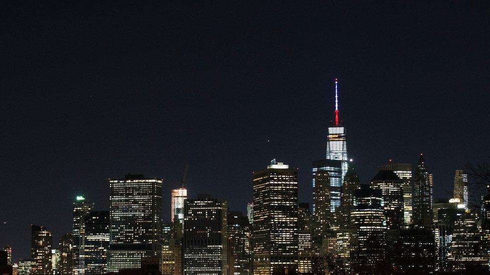 One World Trade Center"s spire is shown lit in French flags colors of white, blue and red in solidarity with France after tonight"s terror attacks in Paris