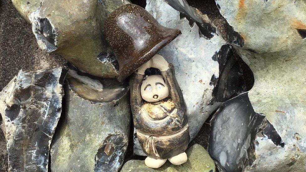 One of the ceramic figures of a Benedictine monk within the walls of the Abbey of St Edmund