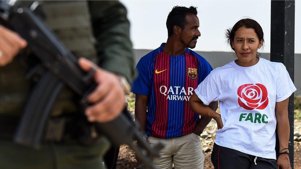 Former members of the Revolutionary Armed Forces in Colombia (FARC) are seen during a visit by United Nations Secretary-General Antonio Guterres (out of frame)