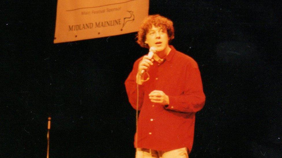 Alan Davies on stage at the Leicester Comedy Festival in 1997