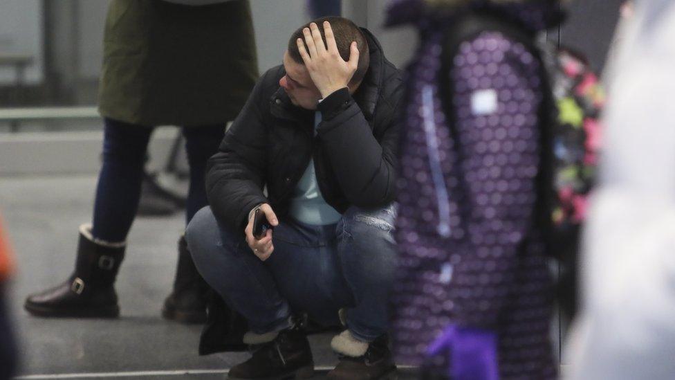 A relative of the crash of Ukraine International Airlines Flight PS752 from Tehran reacts, at Boryspil International Airport in Kiev, Ukraine