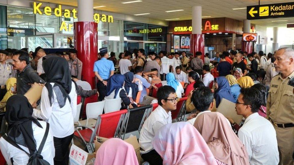 Relatives of passengers of the Lion Air plane that crashed into the sea are seen at Depati Amir airport in Pangkal Pinang, Belitung island, Indonesia, October 29, 2018.