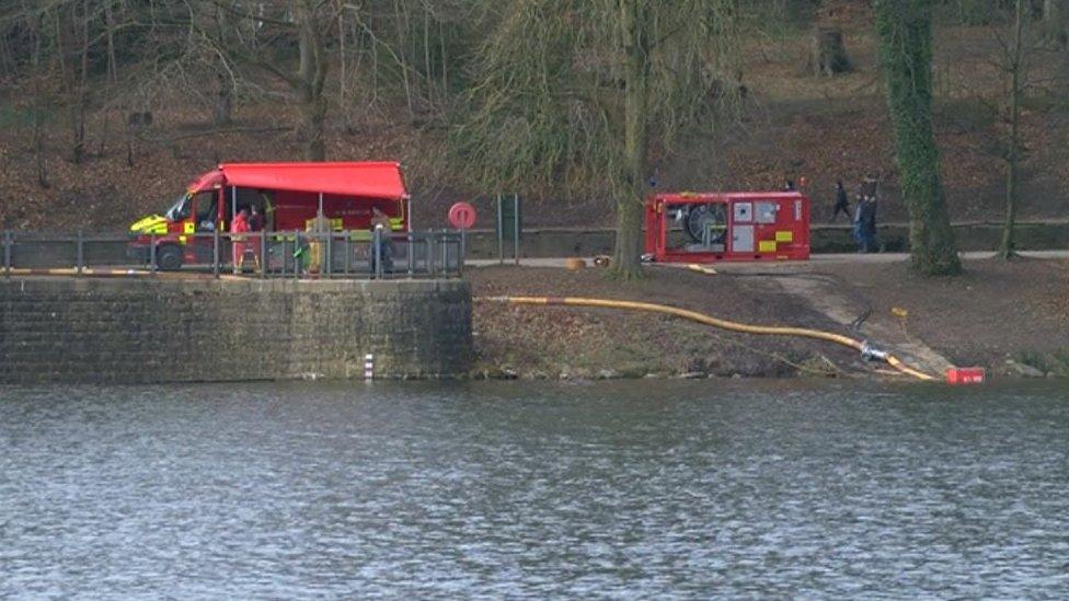 Firefighters pumping water