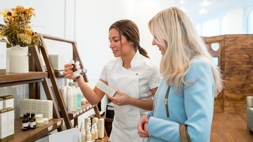 Woman shopping for beauty products at a store