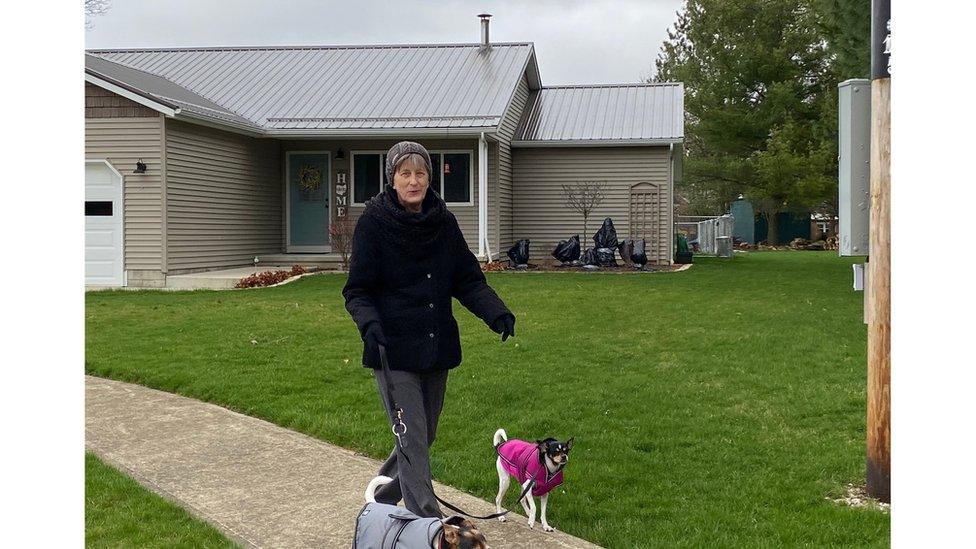 Sheri Thomas walking her dogs